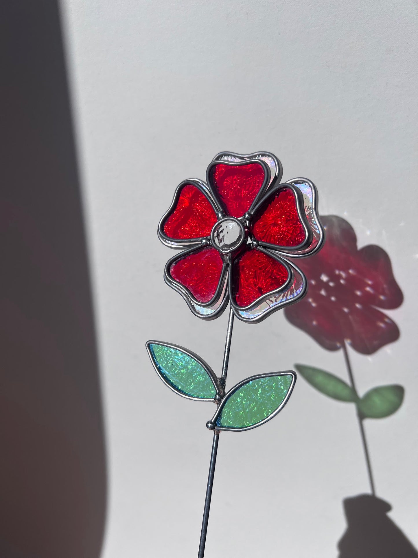 Deep Ruby Red and Rainbow Iridescent Stained Glass Flower with Faceted Round Gem Center