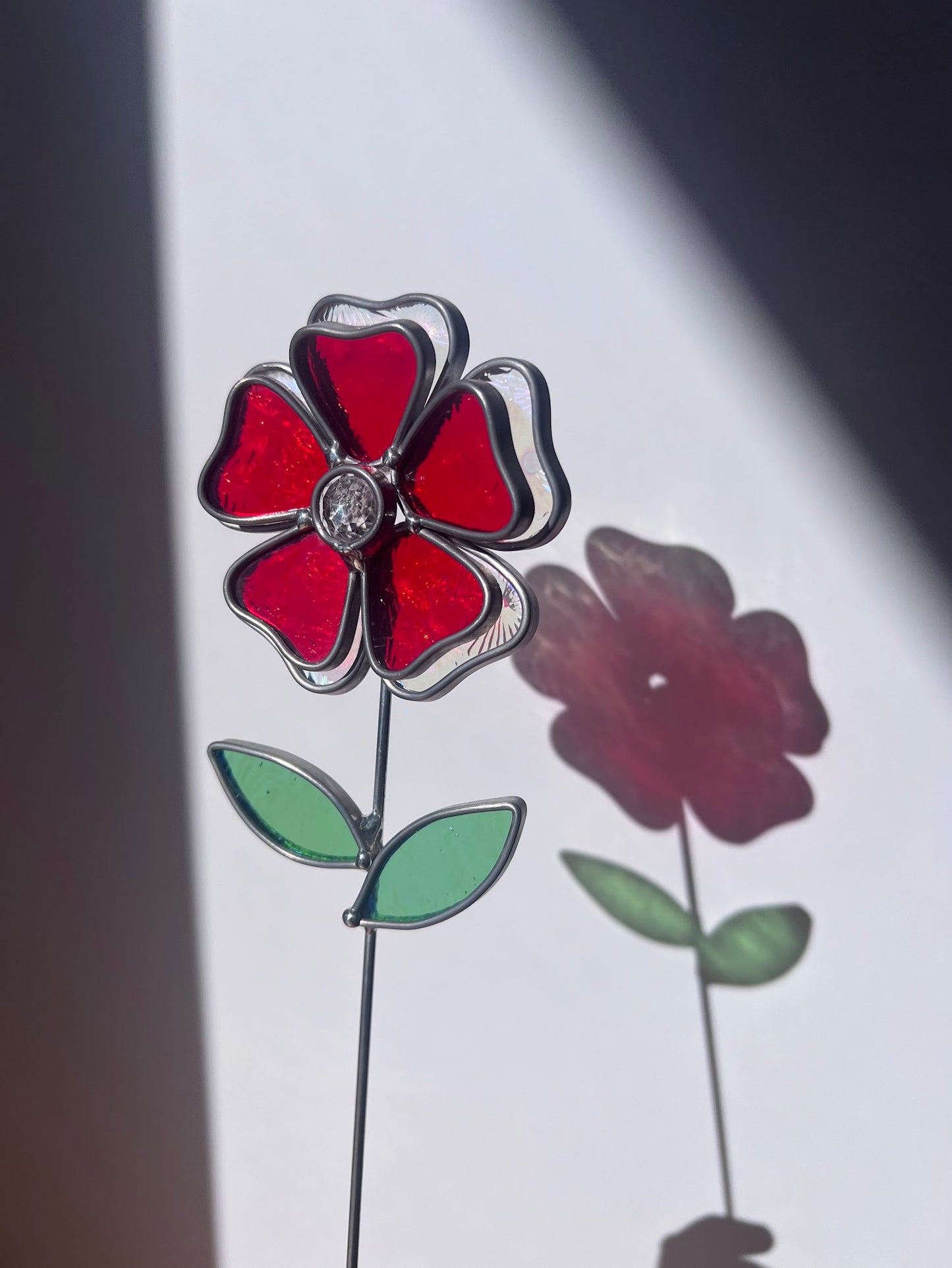 Deep Ruby Red and Rainbow Iridescent Stained Glass Flower with Faceted Round Gem Center