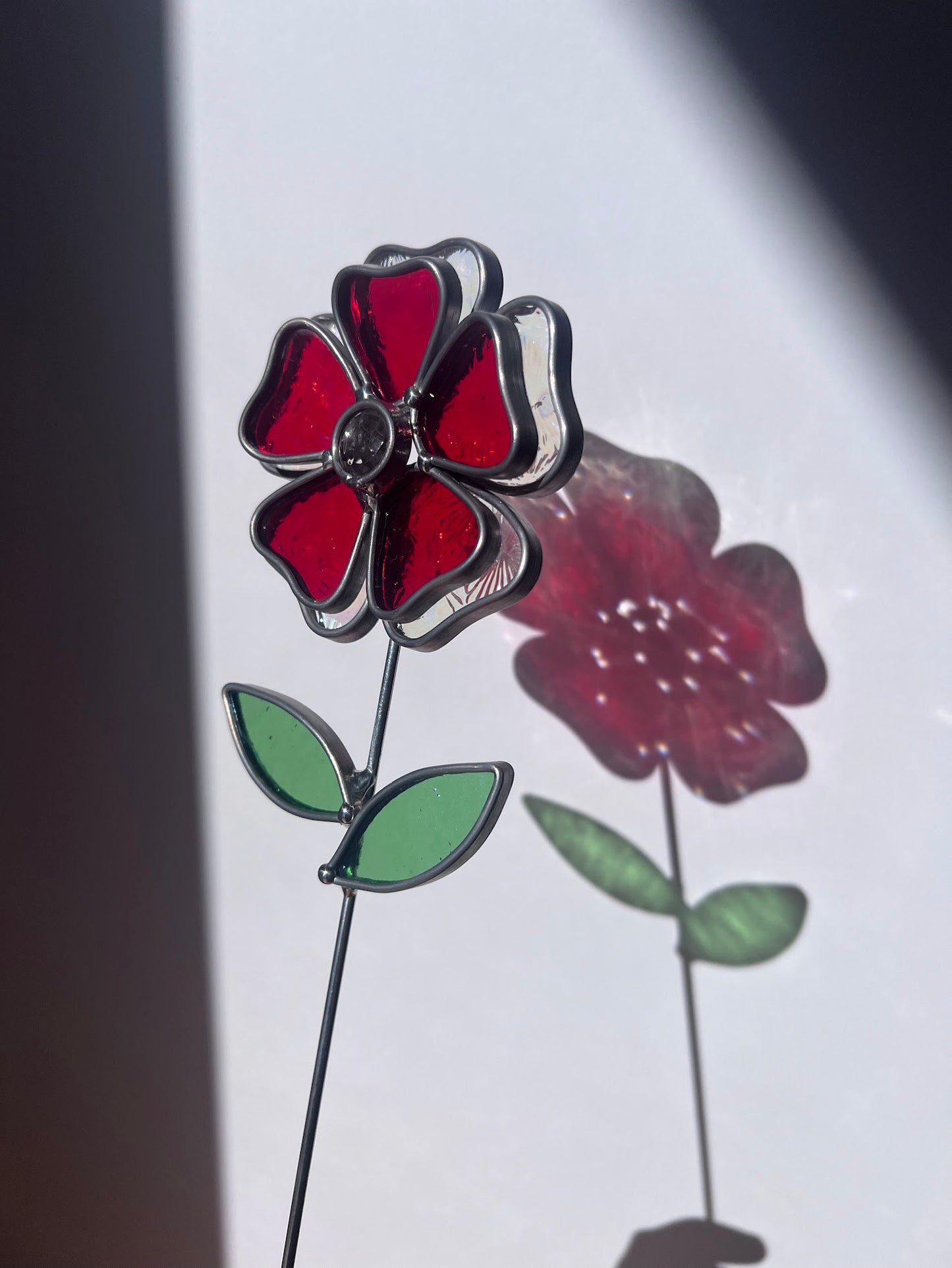 Deep Ruby Red and Rainbow Iridescent Stained Glass Flower with Faceted Round Gem Center