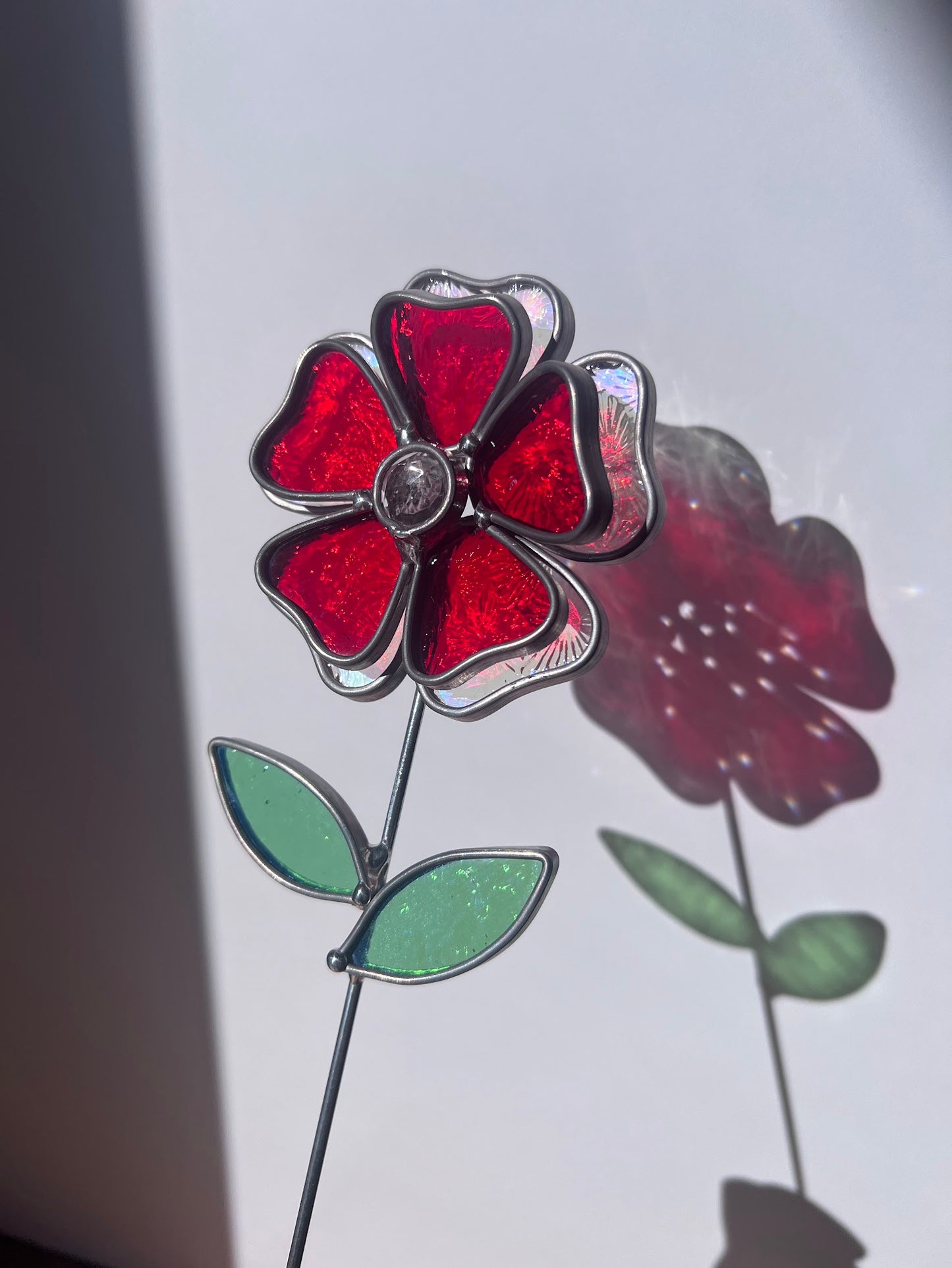 Deep Ruby Red and Rainbow Iridescent Stained Glass Flower with Faceted Round Gem Center