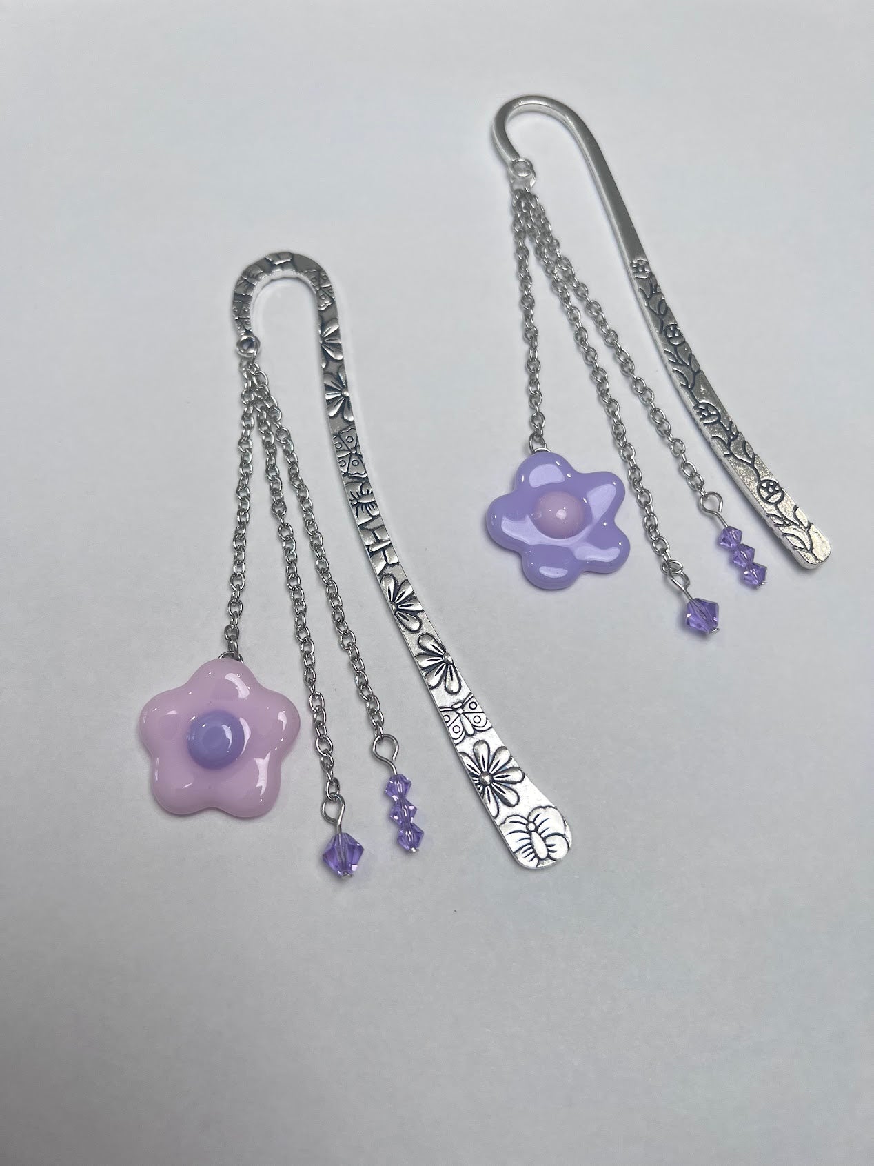 Adorable Baby Pink Stained Glass Fused Daisy and Crystal Bead Metal Bookmark! Carefully crafted with crystal beads and a stained glass daisy to elevate the cuteness vibes as you read!