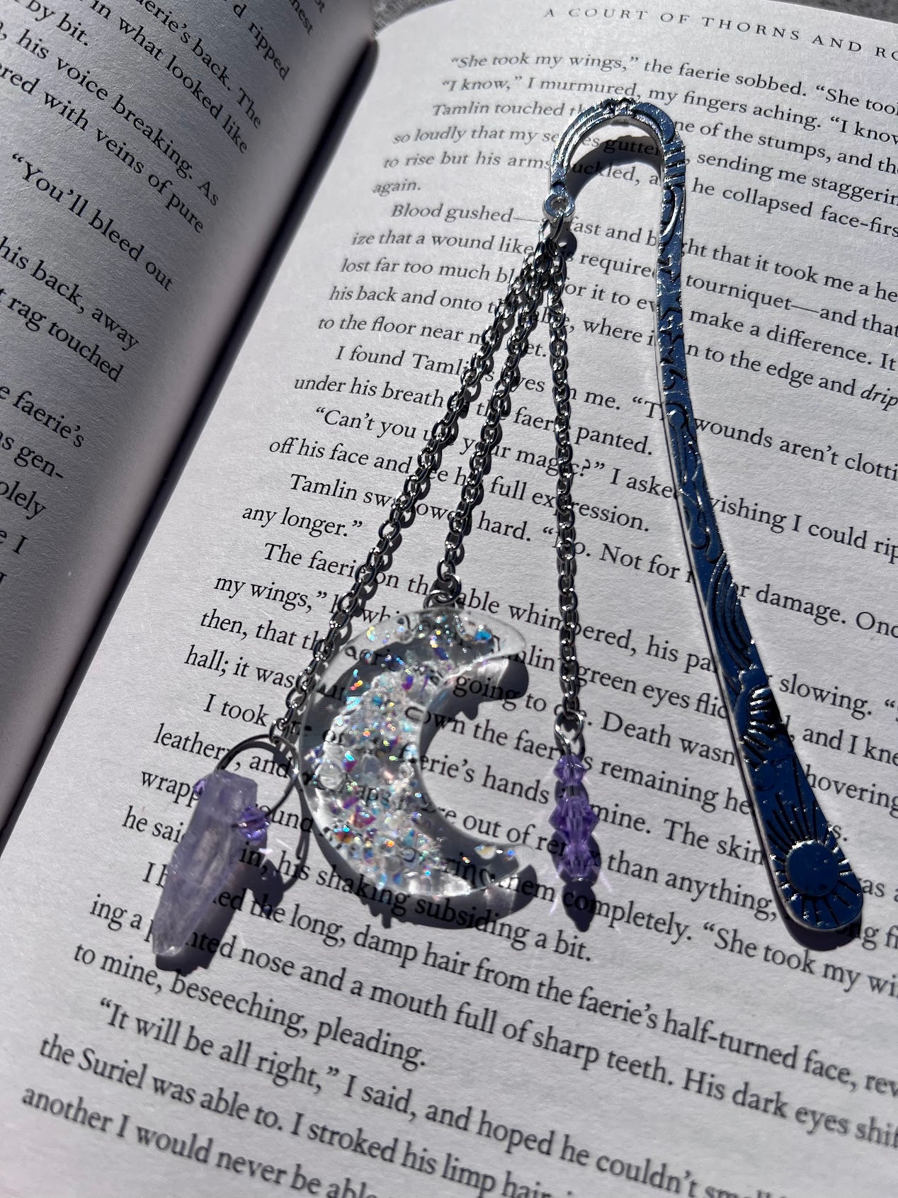 Dichroic Glass Moon, Quartz & Crystal Bead Metal Bookmark! Carefully crafted with a handmade dichroic glass moon, quartz & crystal bead to help elevate your starry dreams as you read!