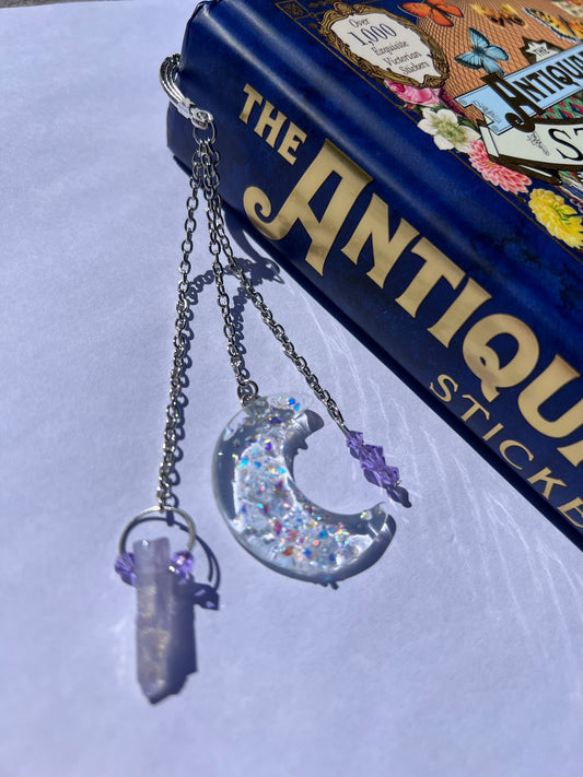Dichroic Glass Moon, Quartz & Crystal Bead Metal Bookmark! Carefully crafted with a handmade dichroic glass moon, quartz & crystal bead to help elevate your starry dreams as you read!