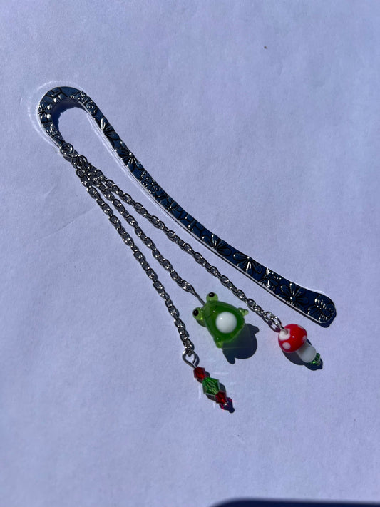 Whimsical Froggy Mushroom Metal Bookmark! Carefully crafted with the love of crystal and glass beads to make the perfect reading companion!